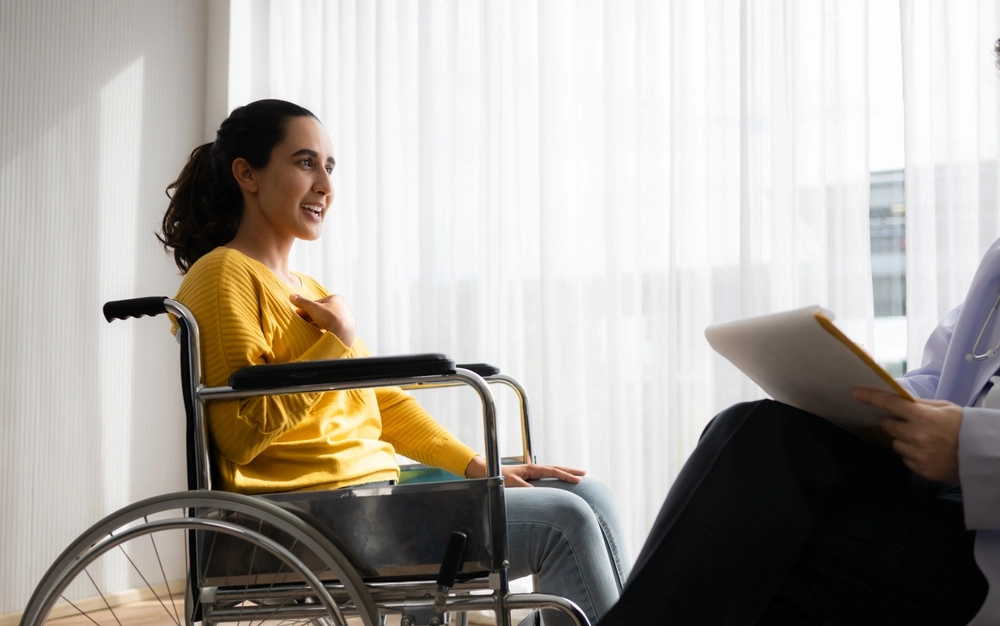 disabled girl on wheelchair with her caretaker
